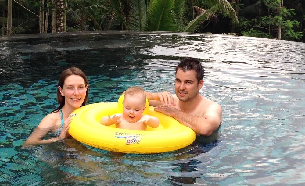 guests with their baby in the pool